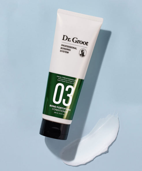 A white and green bottle of Dr. Groot Professional Bonding System Bond Fortifying #3 Conditioner with black cap lying on a light blue background