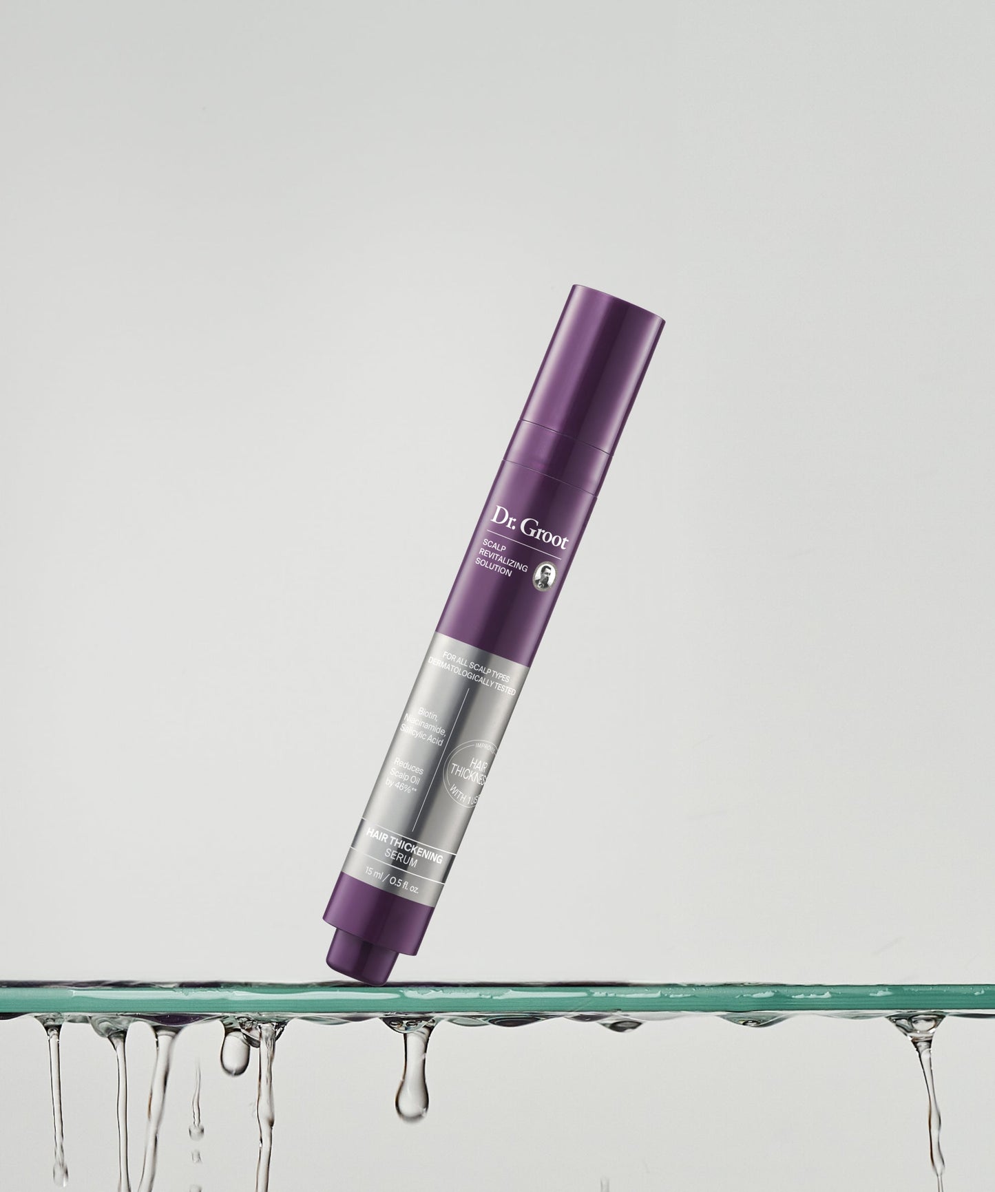 Dr. Groot Scalp Revitalizing Hair Thickening Roll-On Serum in a luxurious shelf setting for a revitalized scalp and fuller hair