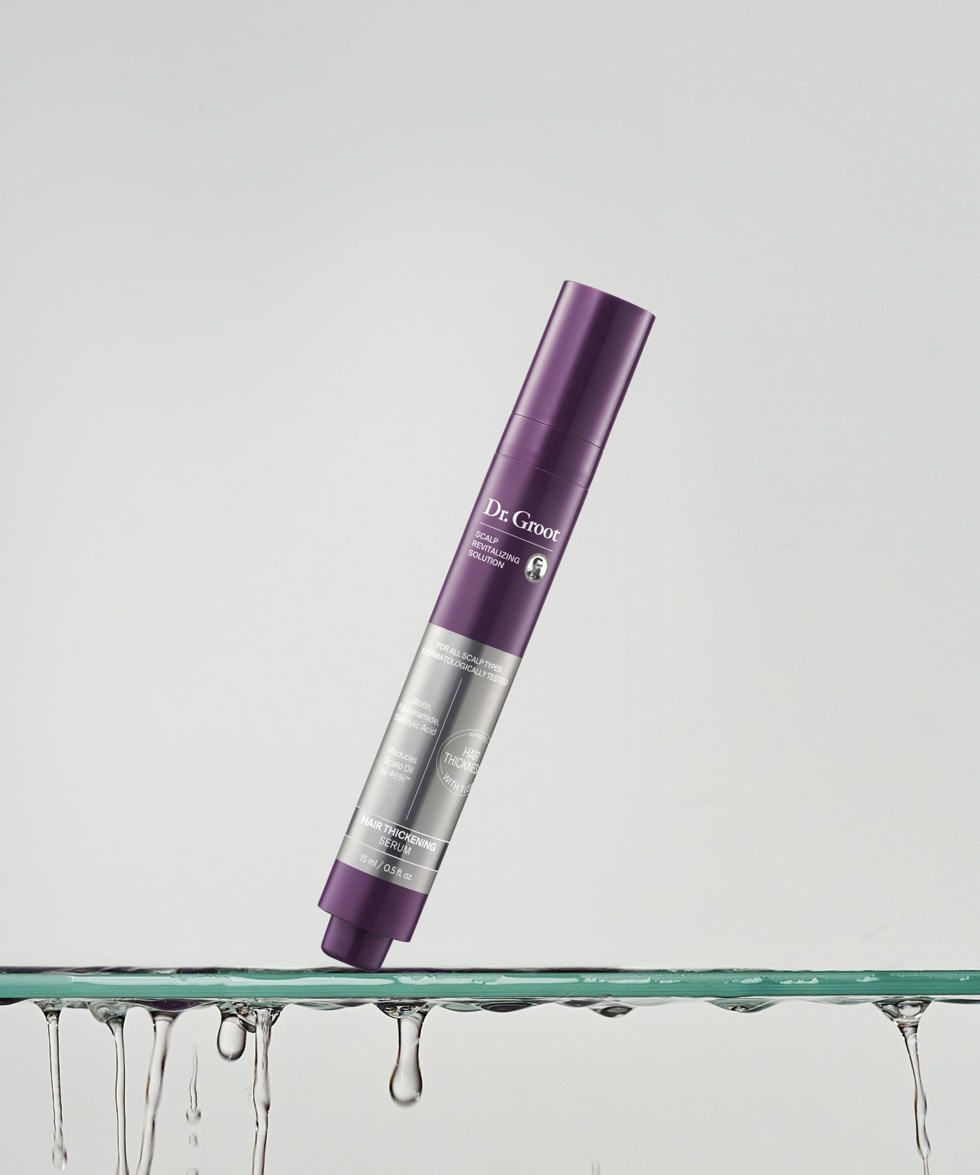 Dr. Groot Scalp Revitalizing Hair Thickening Roll-On Serum in a luxurious shelf setting for a revitalized scalp and fuller hair