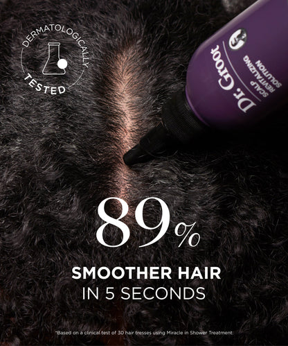 A model applying the Scalp Revitalizing Solution Miracle In-Shower Treatment to damp hair, gently massaging it into the scalp for deep nourishment and hydration.