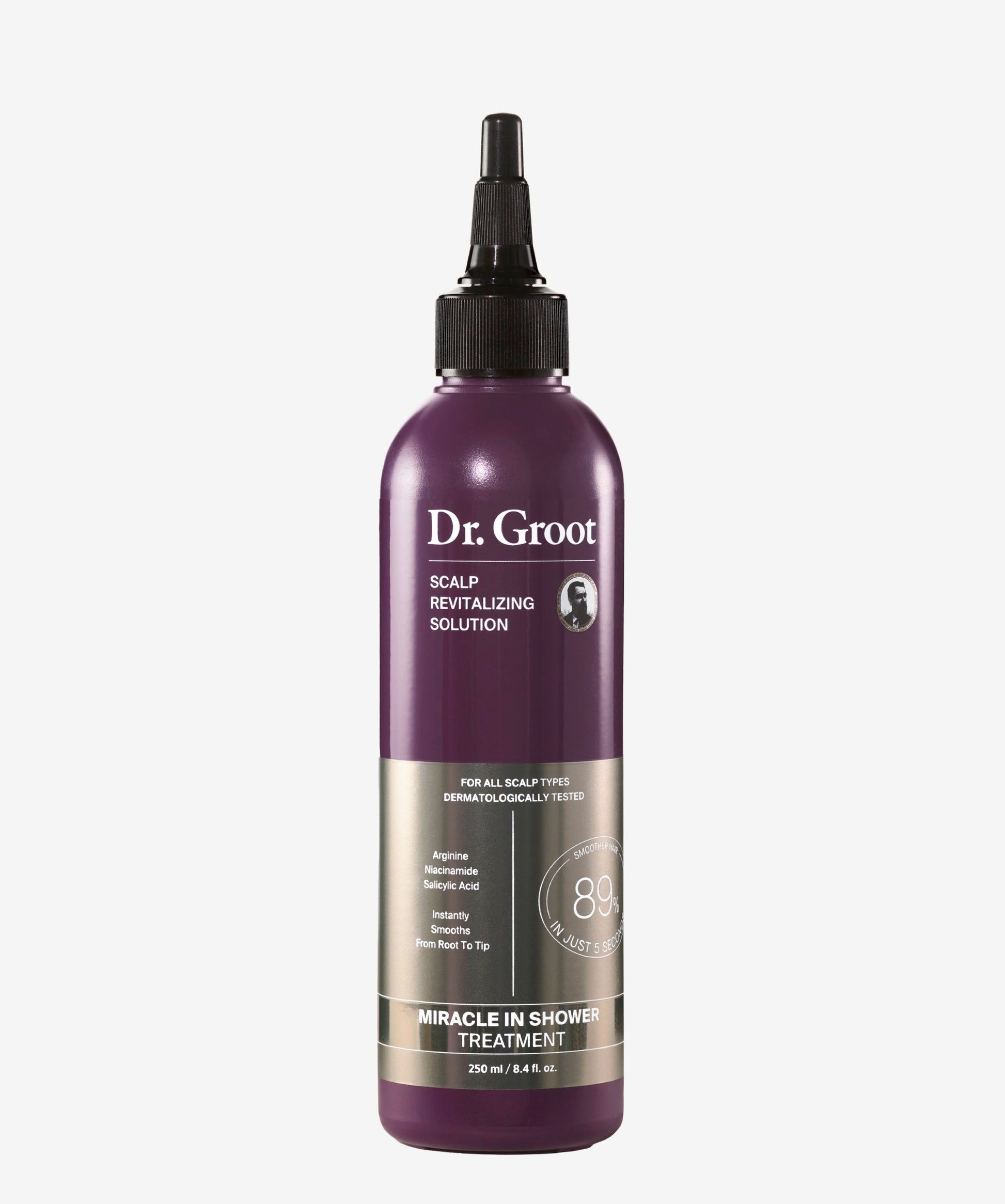A purple and silver bottle of Dr. Groot Scalp Revitalizing Solution Miracle in Shower Treatment with black cap